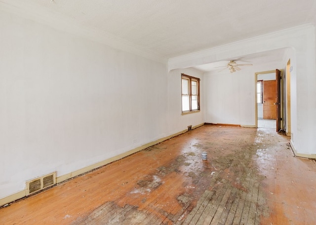 empty room featuring hardwood / wood-style flooring and ceiling fan