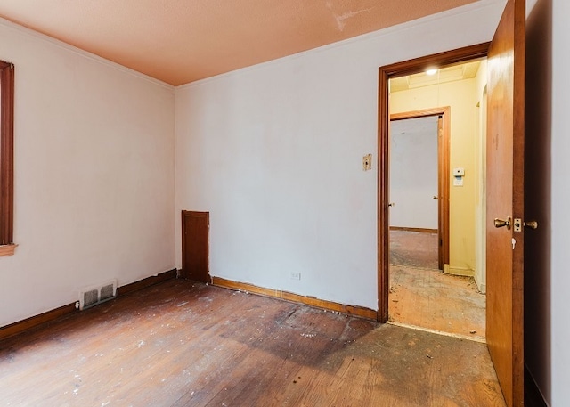 unfurnished room with wood-type flooring