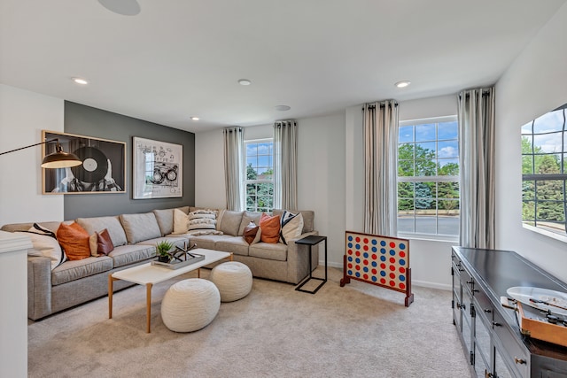 living room with light colored carpet and a healthy amount of sunlight