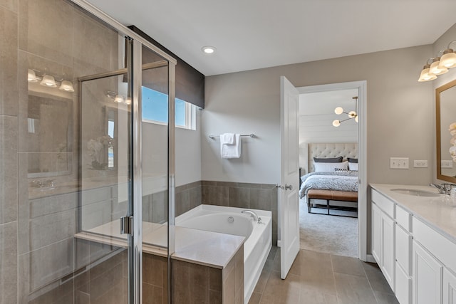 bathroom featuring vanity, tile patterned floors, and independent shower and bath