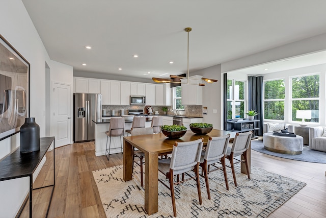 dining area featuring light hardwood / wood-style floors and sink