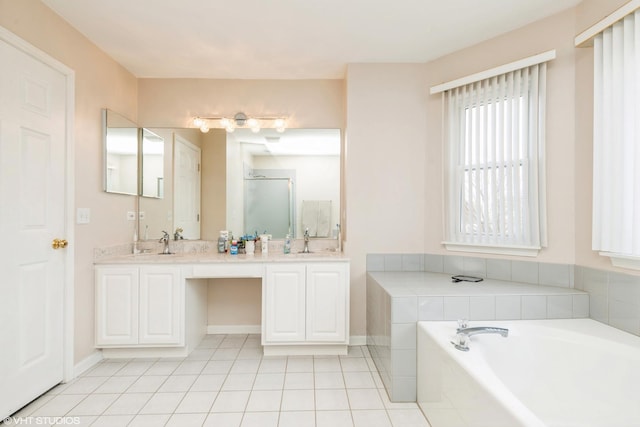 bathroom featuring vanity, tile patterned floors, and separate shower and tub