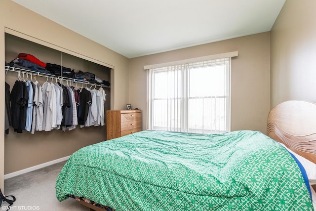 carpeted bedroom with a closet