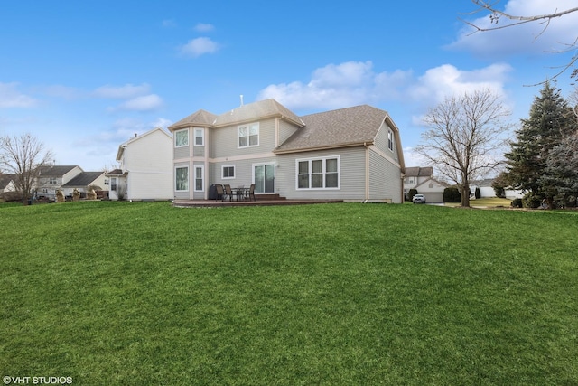 rear view of house with a yard and a patio