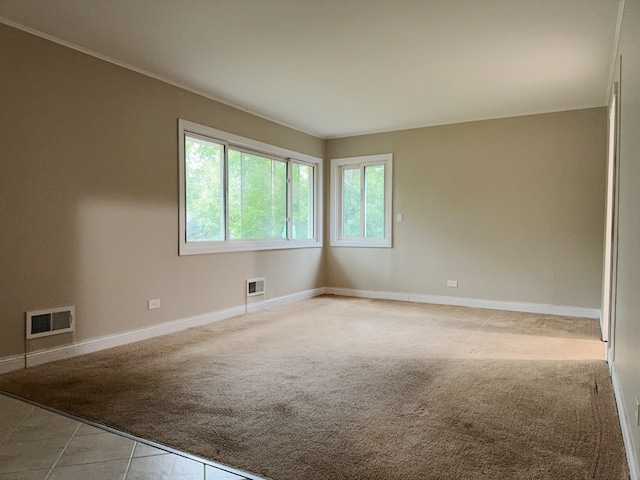 empty room with light colored carpet