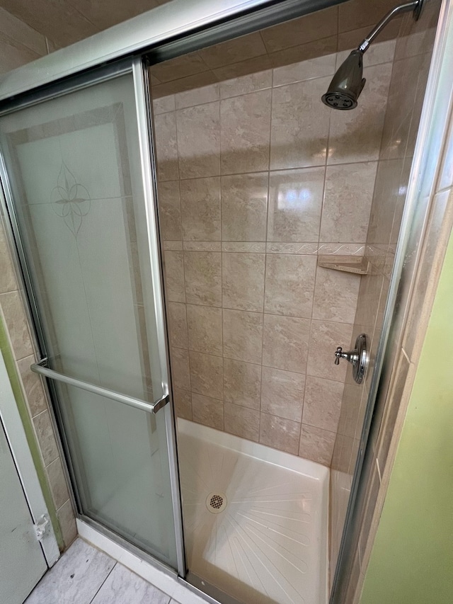 bathroom featuring an enclosed shower