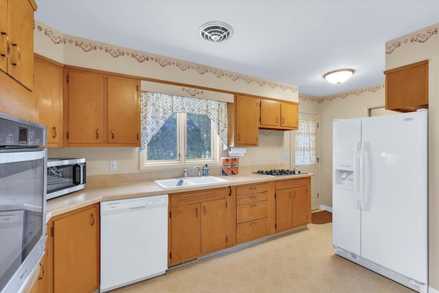 kitchen featuring sink and appliances with stainless steel finishes