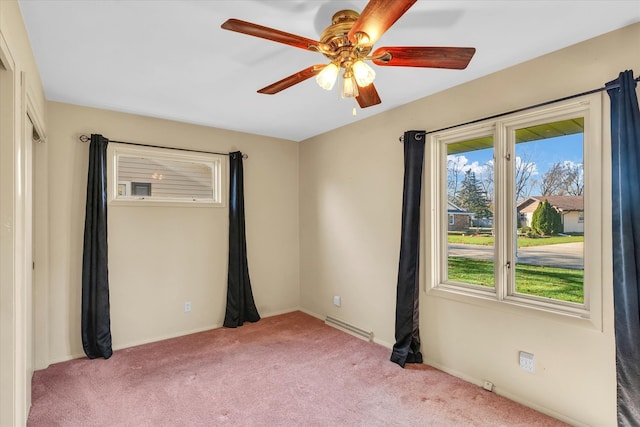 carpeted empty room featuring ceiling fan