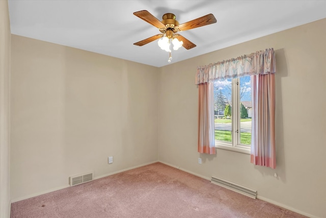 unfurnished room featuring light colored carpet and ceiling fan