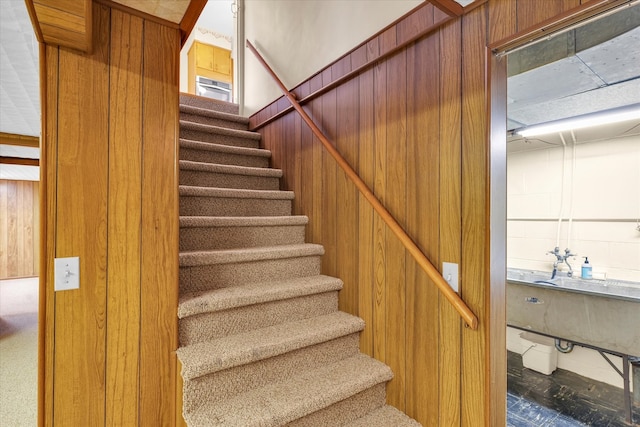 staircase with wooden walls