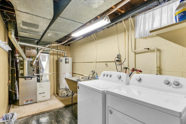 laundry area featuring separate washer and dryer, water heater, sink, and heating unit