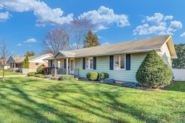 single story home featuring a porch and a front lawn