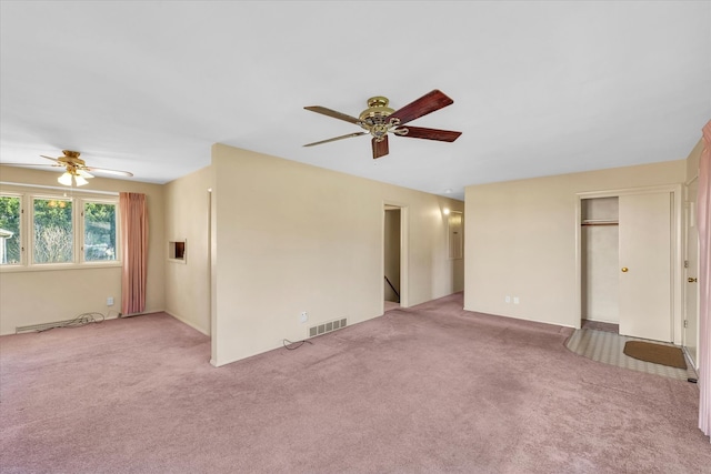 carpeted empty room with ceiling fan