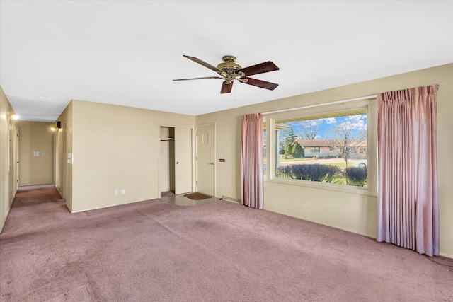 unfurnished room featuring carpet flooring and ceiling fan