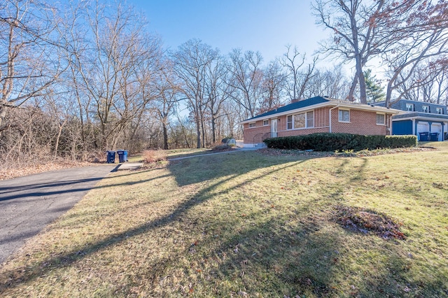 view of home's exterior with a yard