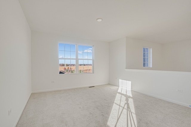 empty room featuring light colored carpet