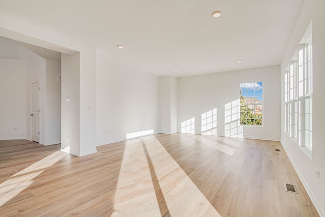 spare room with light wood-type flooring