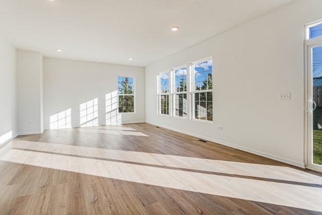 unfurnished room featuring light hardwood / wood-style floors