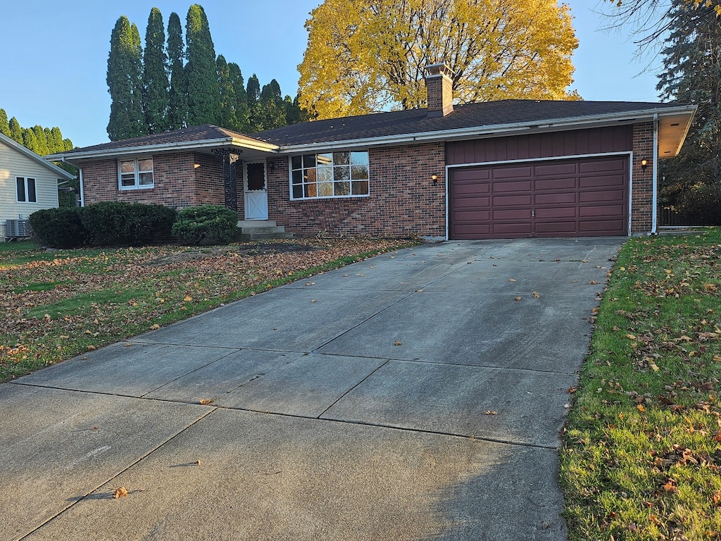 single story home featuring a garage