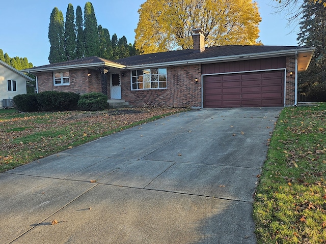 single story home featuring a garage