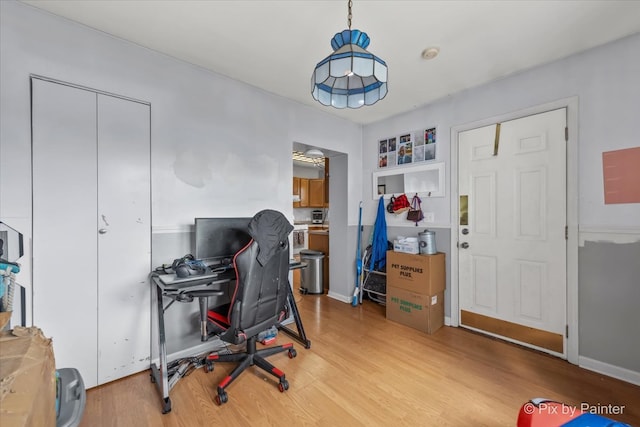 office with light hardwood / wood-style flooring