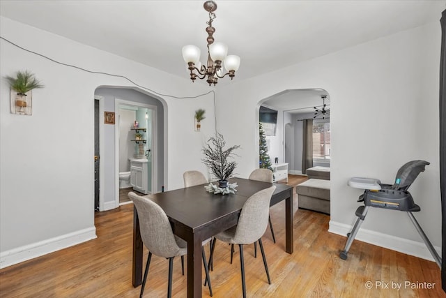 dining area featuring a chandelier and light hardwood / wood-style floors