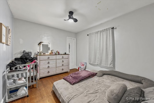 bedroom featuring hardwood / wood-style floors and ceiling fan