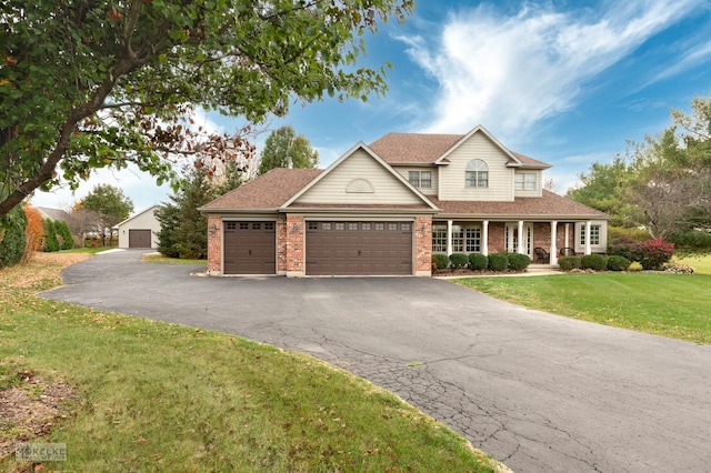 view of front of property featuring a garage and a front yard