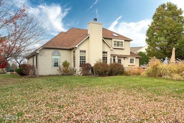 rear view of house with a lawn