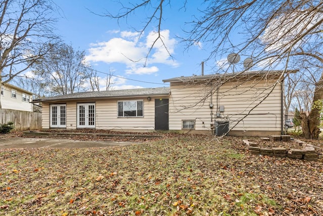 back of property featuring central AC unit and french doors