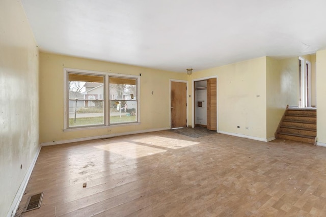 spare room with light hardwood / wood-style floors