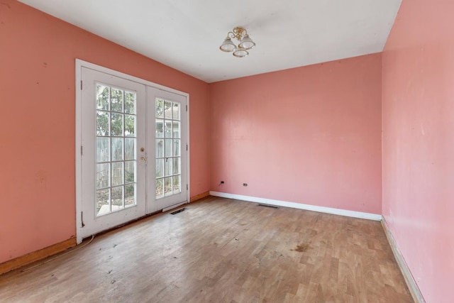 doorway to outside featuring light wood-type flooring and french doors