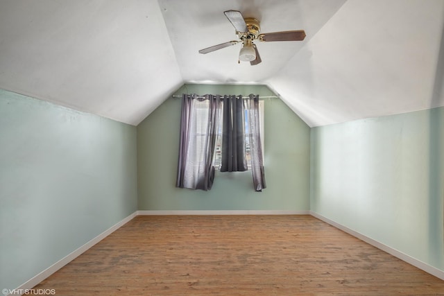 additional living space with hardwood / wood-style floors, ceiling fan, and lofted ceiling