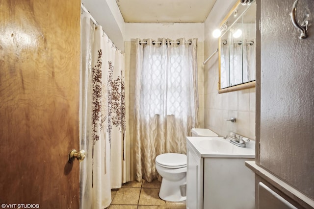 bathroom with tile patterned floors, vanity, and toilet