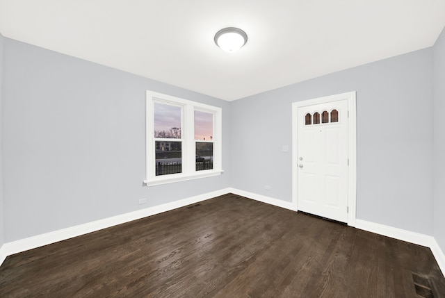 foyer entrance with dark hardwood / wood-style floors