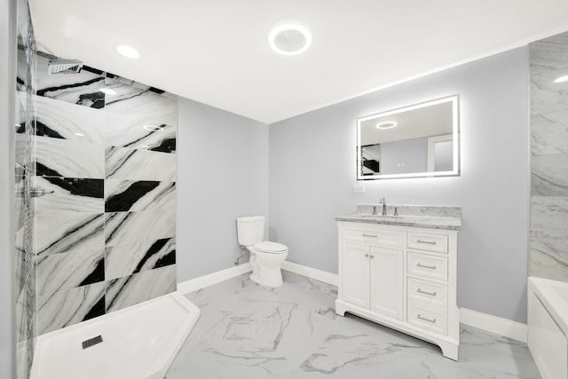 bathroom with vanity, toilet, and tiled shower