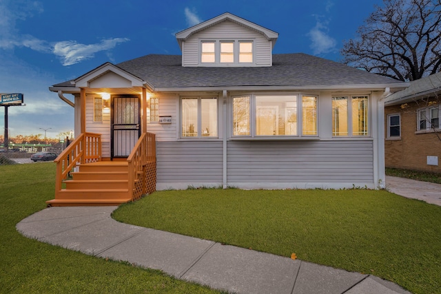 view of front of house featuring a lawn