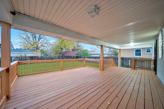 wooden deck with a lawn