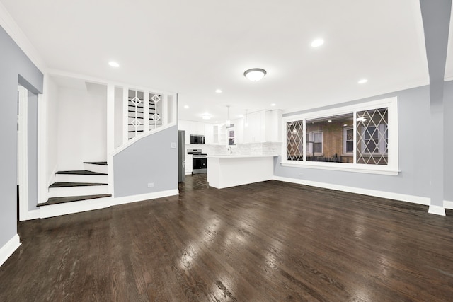 unfurnished living room featuring dark hardwood / wood-style floors and crown molding