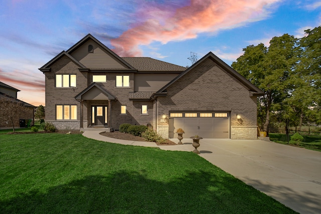 view of front facade with a garage and a yard