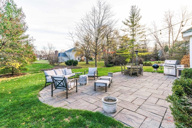 view of patio / terrace with an outdoor living space and area for grilling