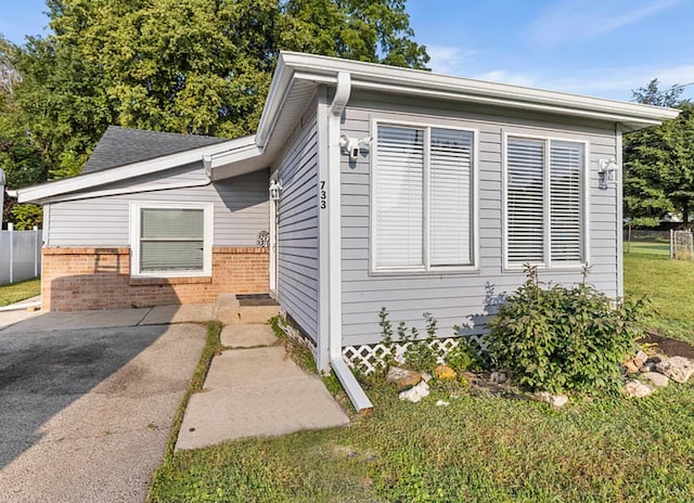 view of property exterior featuring a yard