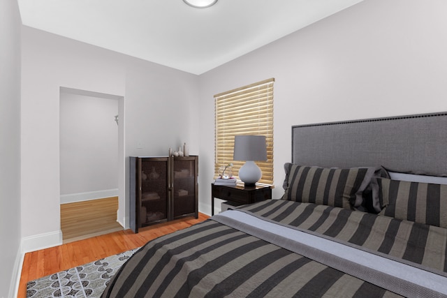 bedroom with hardwood / wood-style flooring