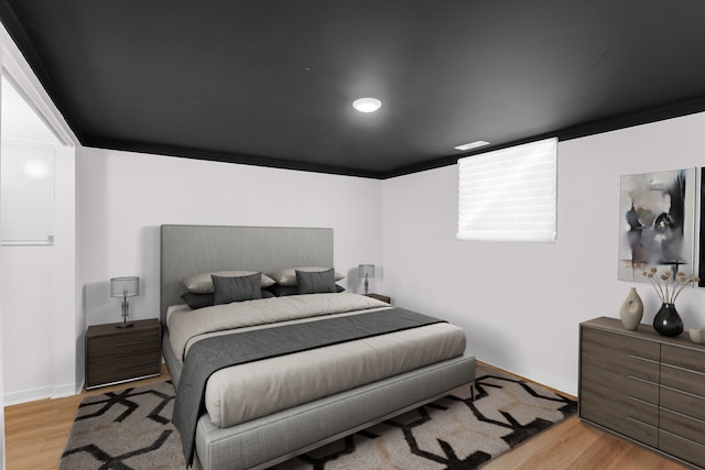 bedroom with light hardwood / wood-style floors