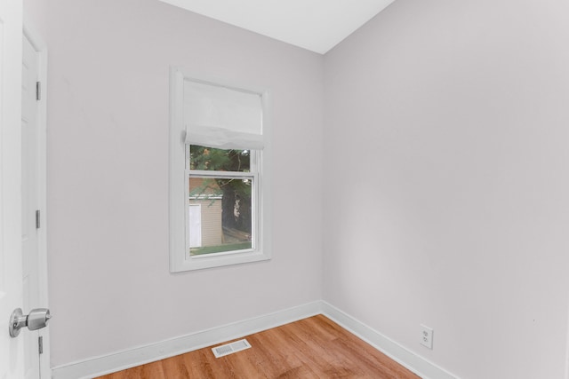 spare room with light hardwood / wood-style floors