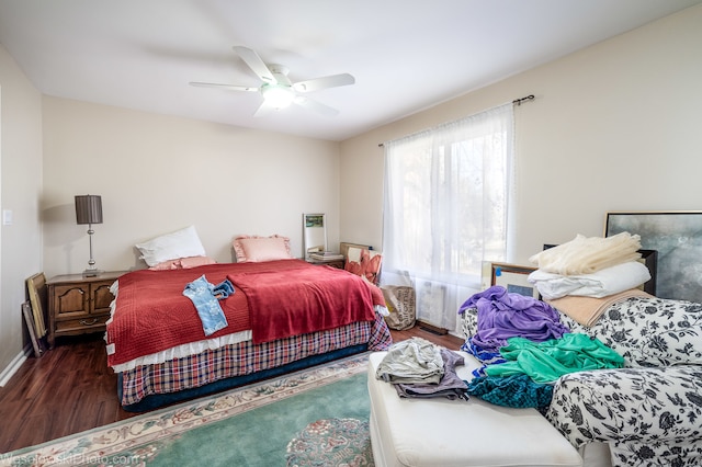 bedroom featuring dark hardwood / wood-style flooring and ceiling fan