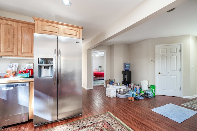 kitchen with dark hardwood / wood-style flooring, ceiling fan, light brown cabinetry, and stainless steel appliances