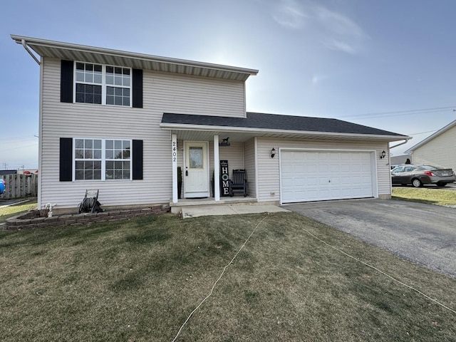 view of front of home featuring a garage and a front lawn