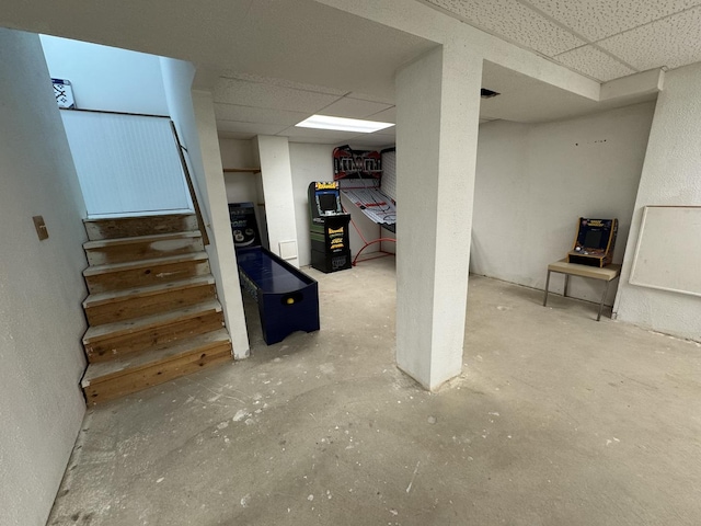 basement featuring a paneled ceiling