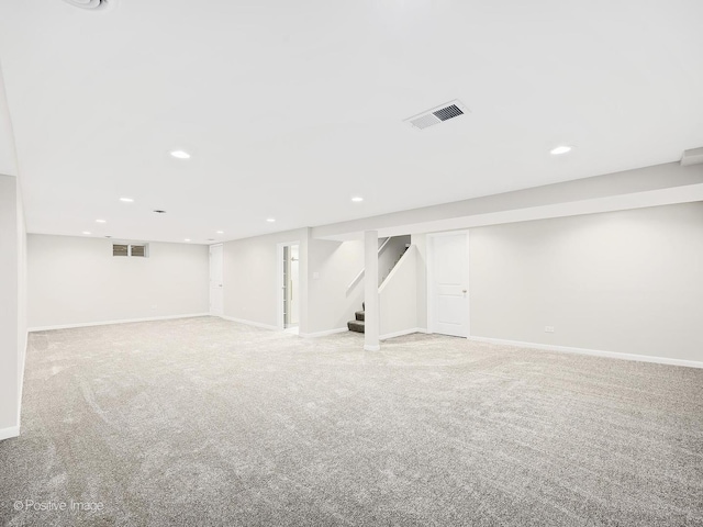 basement with light colored carpet